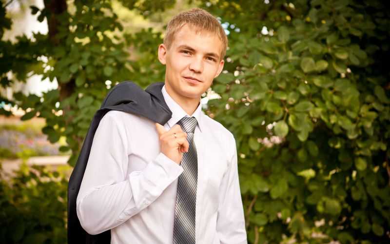 man with tie outdoors